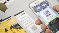 Passenger scans QRcode to download the story
