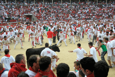 Runners during the running of bulls in San Fermín (Pamplona)
